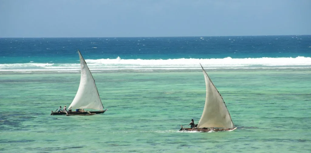 Sailing boats on turquoise coastal water
